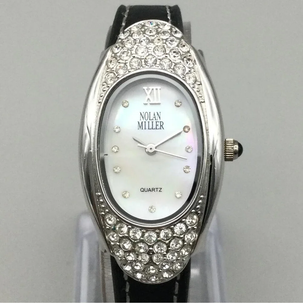 Nolan Miller Womens Watch 22mm Silver Crystals Black Leather MOP Oval Dial